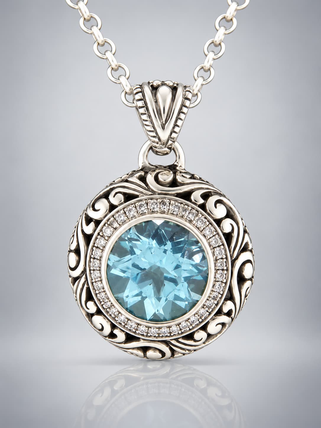 Blue Topaz faceted sterling silver pendant