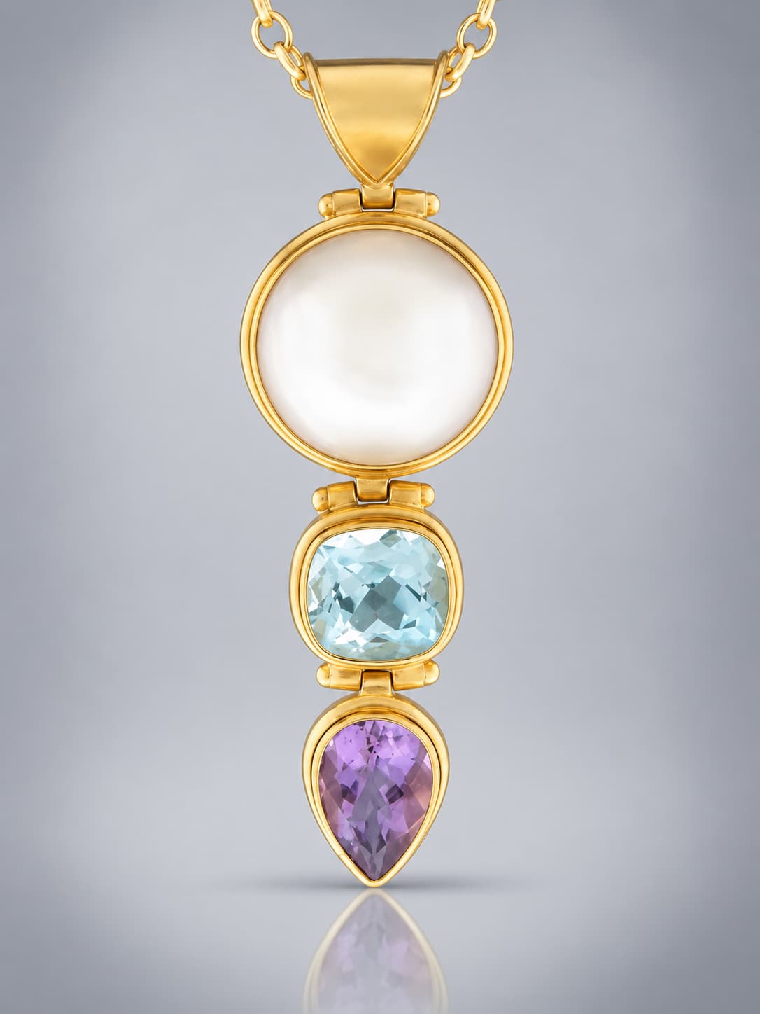 pearl with amethyst and blue topaz pendant