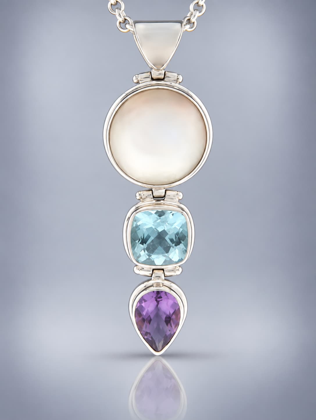 sterling silver pearl and blue topaz and faceted amethyst pendant
