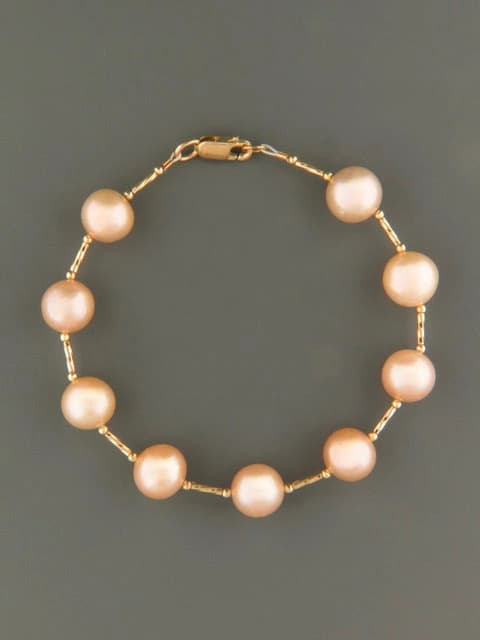 10mm pink pearl bracelet with gold twist beads