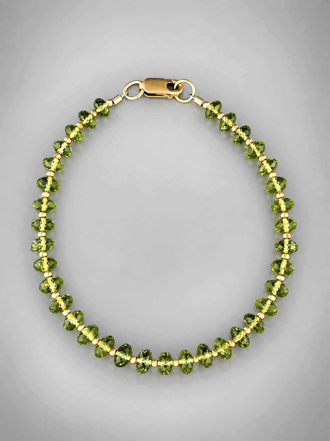 peridot bracelet with gold beads