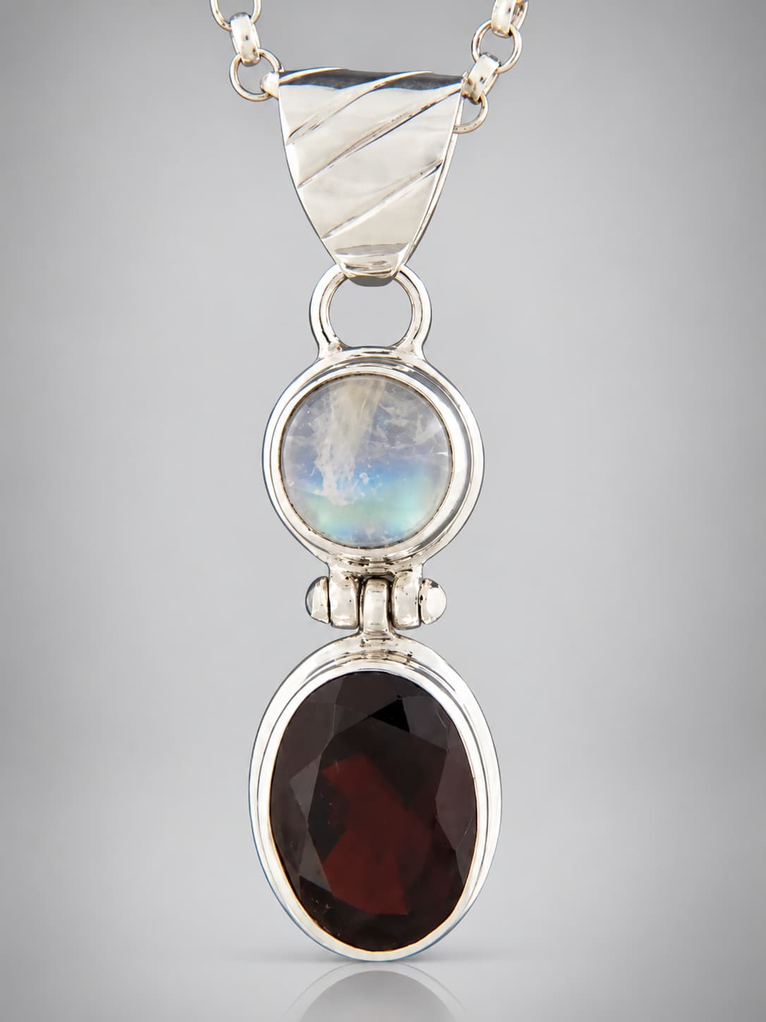 Garnet and moonstone sterling silver pendant